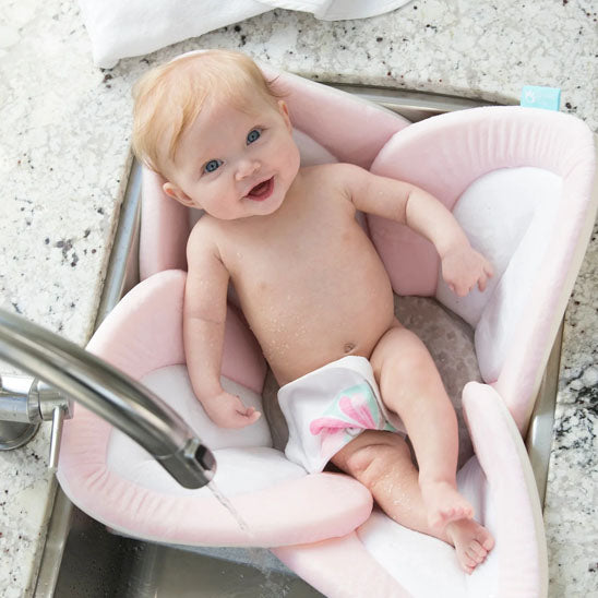 siege-de-bebe-pour-le-bain-blanc-rose